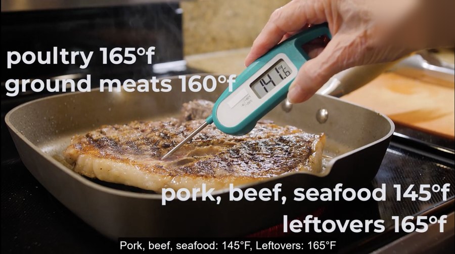 Video frame: a food thermometer checking a cooked meal, on-screen text lists safe minimum temperatures for poultry, ground meats, pork, beef, seafood, and leftovers.